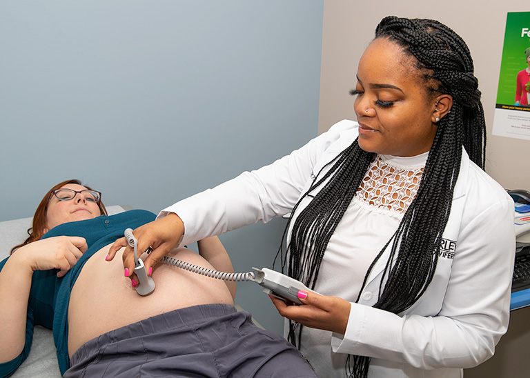 Nurse/Midwife with a newborn