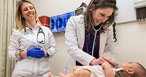 Pediatric Nurse Practitioners examining a patient