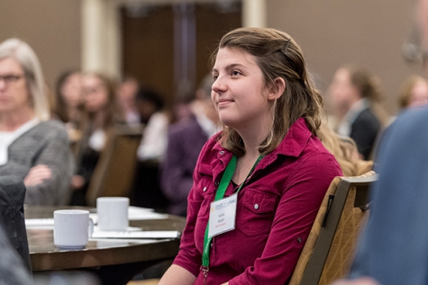 Wyatt listening to a presentation at 2017 Dean's Research Day