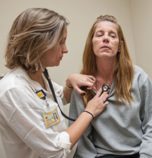 Student examines patient