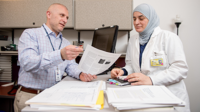 Michigan nursing student asks a male co-worker about a question on her paper