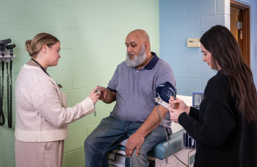 Students Working with Patient