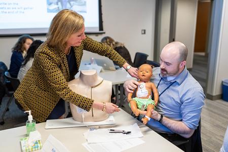 Duffy leading an interprofessional workshop for nursing, dentistry and social work students focused on central line infections. 