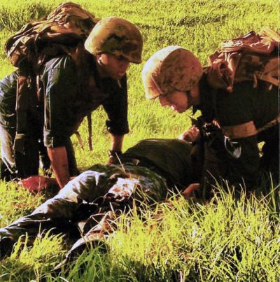 DeLong (right) during an exercise as part of a Tactical Combat Casualty course 