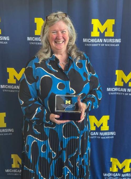  Dr Kane Low in front of a Michigan Nursing Background