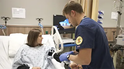 BSN nursing student with a patient