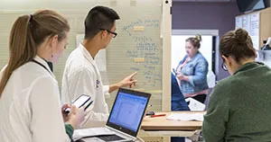 Three nurses discussing about a patient prior to going into the room